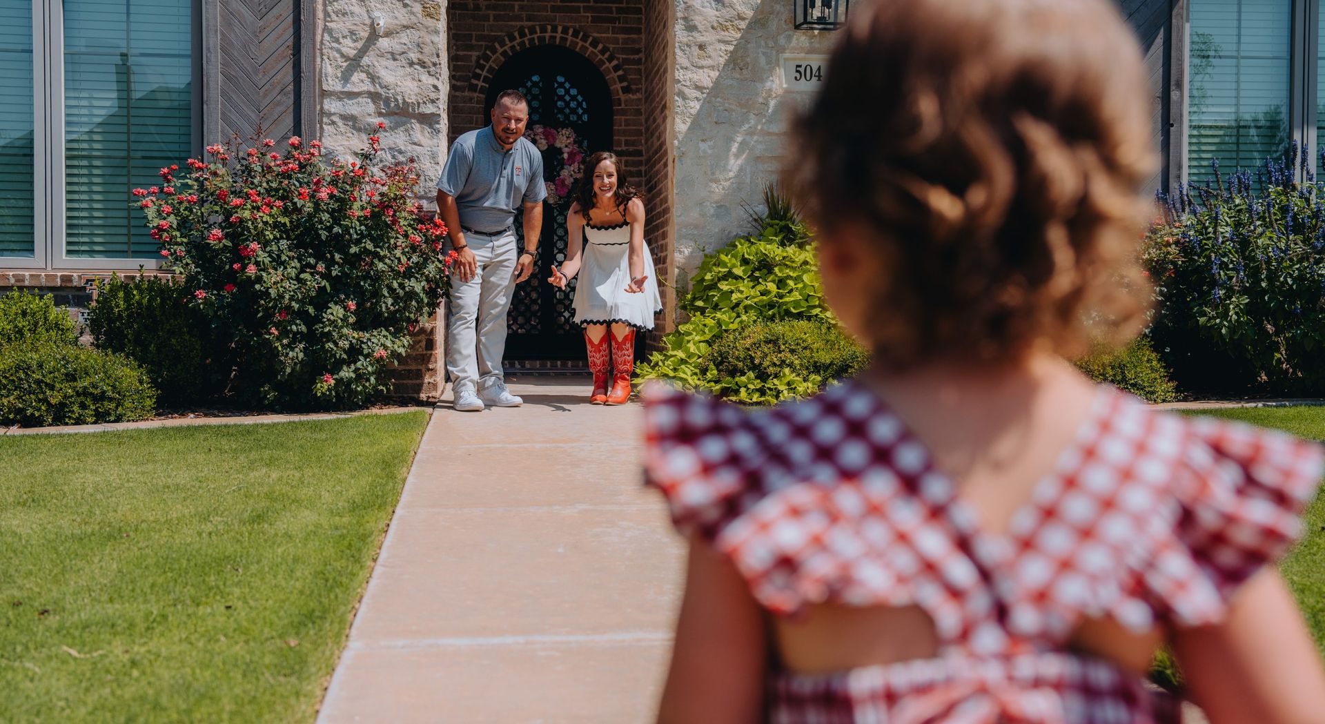 A family walking up to their new West Texas home