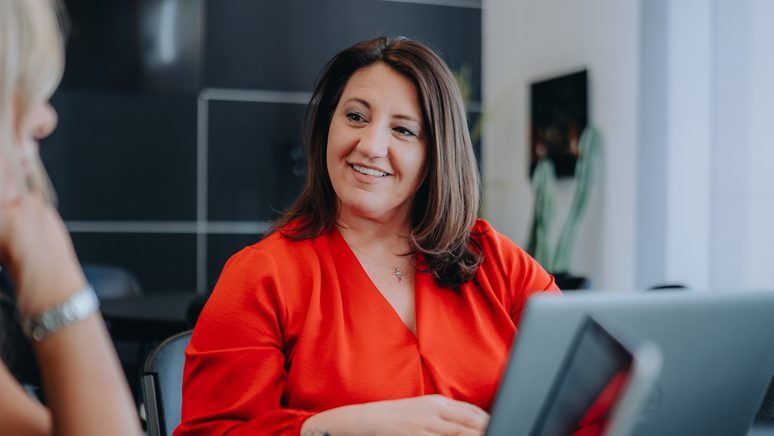 A Texas Tech Credit Union loan officer with a member