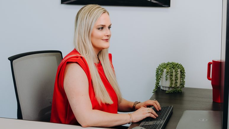 A Texas Tech Credit Union loan officer at her desk