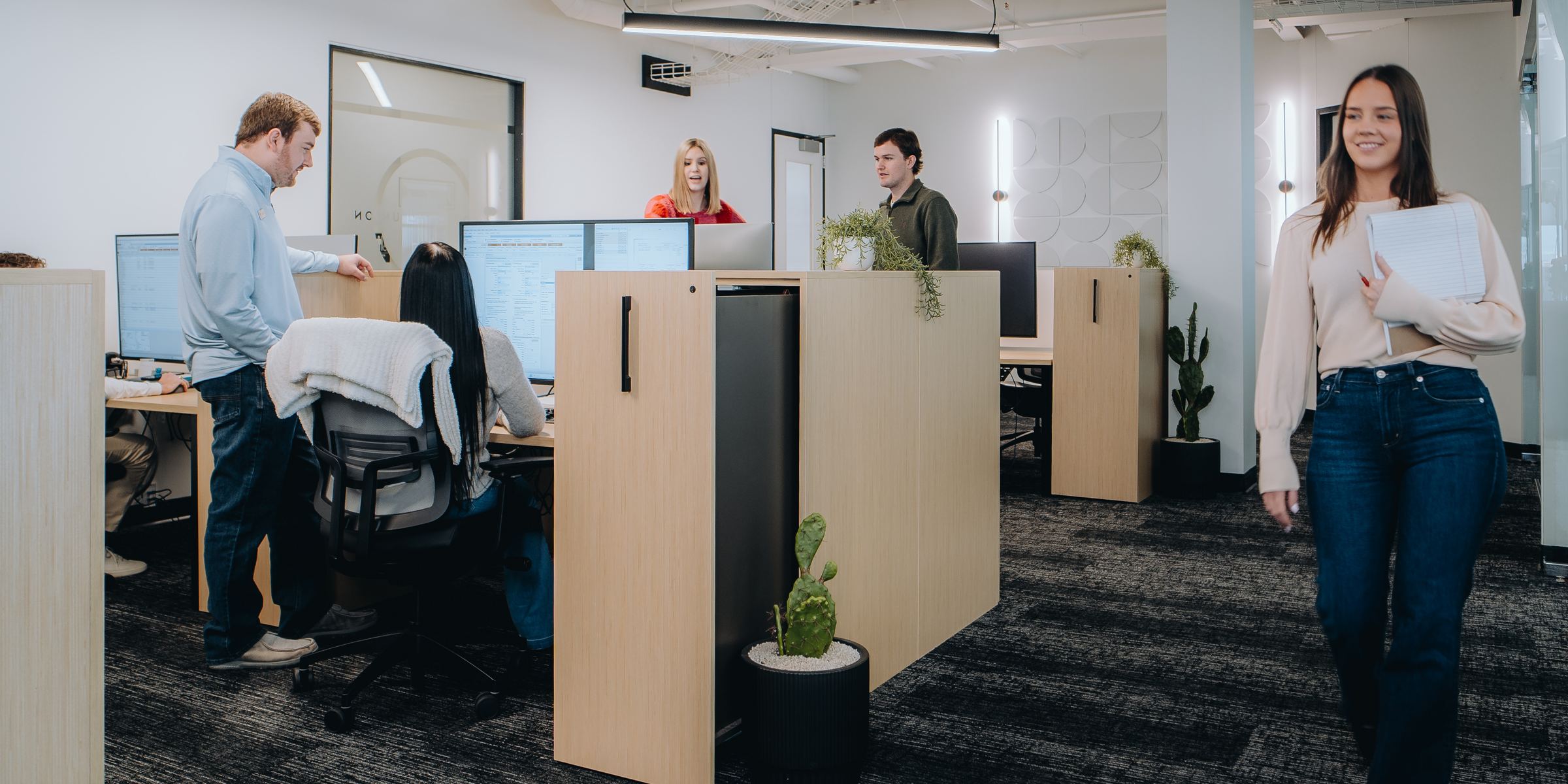 Texas Tech Credit Union team members at work in the office
