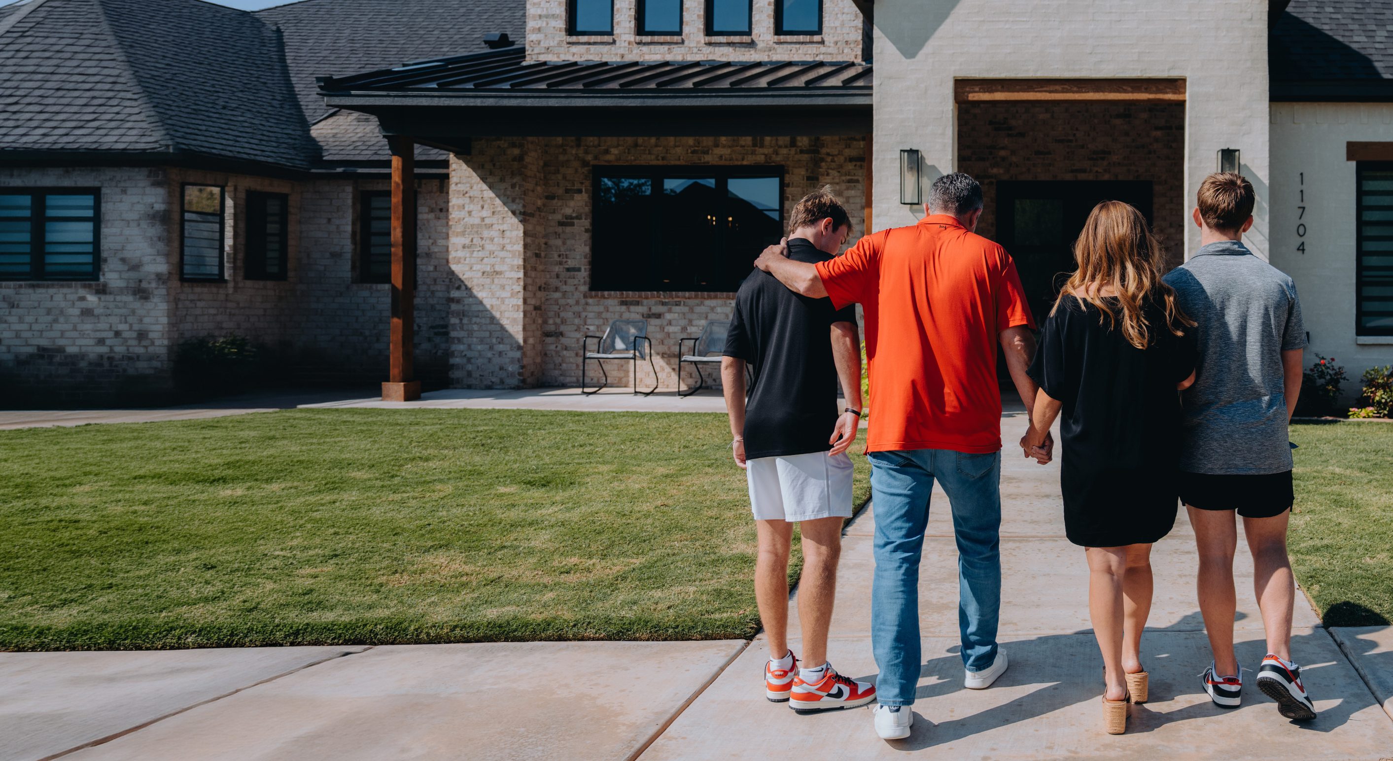 A family walking up to their new West Texas home
