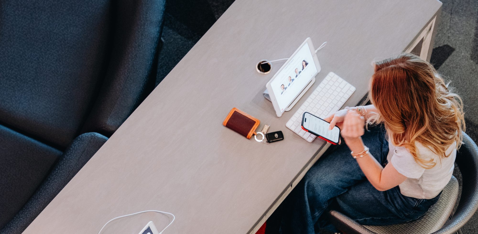 Member using the Texas Tech Credit Union mobile app at a desk