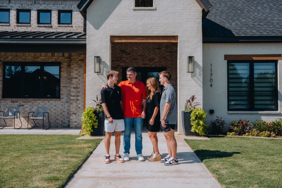Family in front of their home
