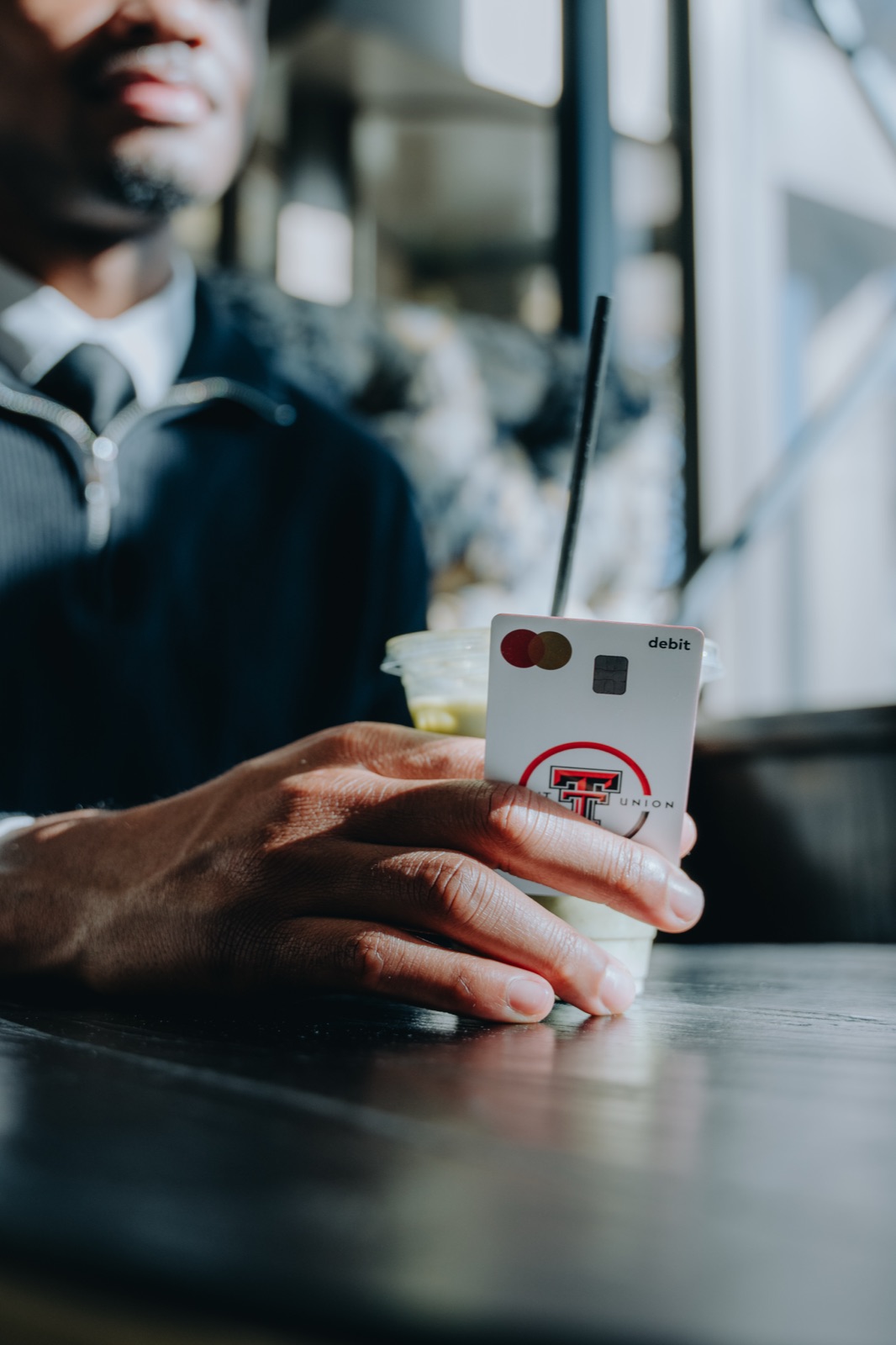 Member paying with their Texas Tech Credit Union card
